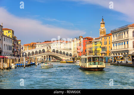 The Rialto Bridge and a vaporetto in a canal of Venice Stock Photo