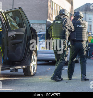 Armed Firearms Police officers demonstrating a vehicle stop and arrest of a suspected armed criminal/terrorist at a police open day Stock Photo