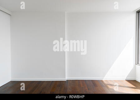 Abstract background from blank white concrete wall at home or office with wooden floor. Picture for add text message. Backdrop for design art work. Stock Photo