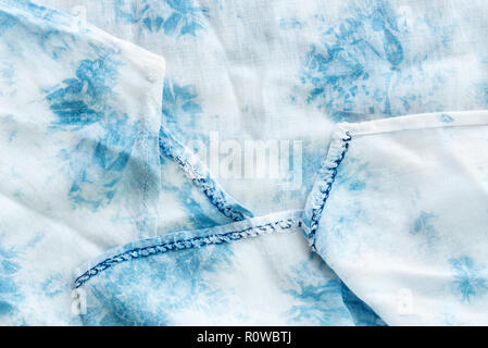 Texture of white and blue soft fabric on table. Abstract background. Picture for add text message. Backdrop for design art work. Stock Photo