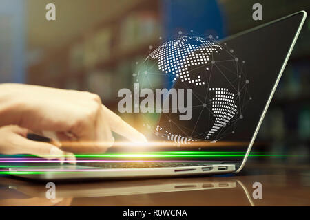 Network technology and internet connection concept. Closeup hand of business people on keyboard laptop. Global symbol from dots and lines on screen. Stock Photo