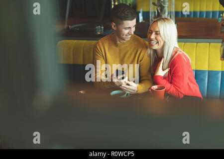 Couple having fun in cafe Stock Photo