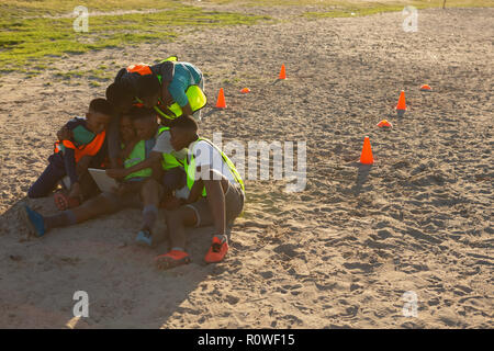 Kids using digital tablet in the ground Stock Photo