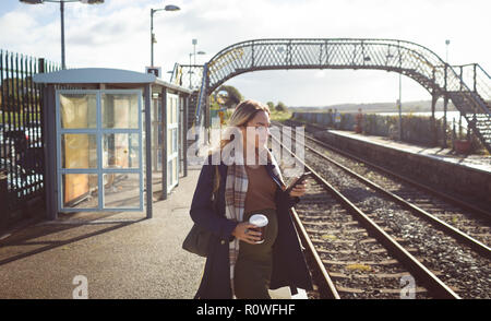 Pregnant woman using mobile phone Stock Photo