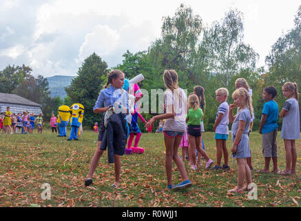 Kamennomostsky, Russia - September 1, 2018: Holiday day of the village with animators and children's playgrounds and competitions in the park in the f Stock Photo