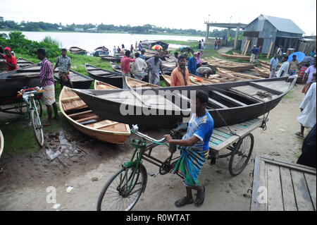 Boat makers display the wooden boat for sale at Kaikkarateke market , Narayanganj district in Bangladesh. On June 21, 2015 Boat makers at the weekly “ Stock Photo