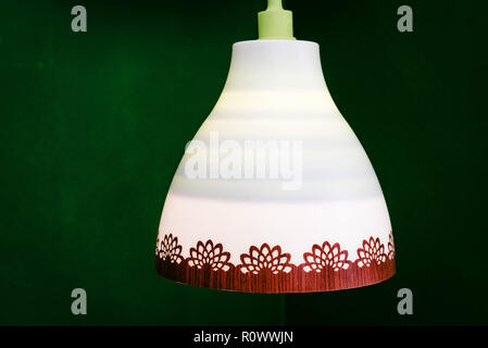 Decorative white chandelier with red pattern on the rim Stock Photo