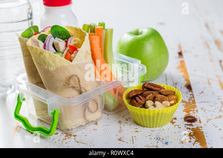 Lunch to go with tortilla wraps and vegetables Stock Photo