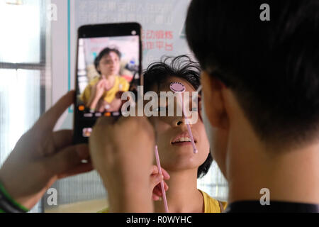 SHANGHAI, CHINA: July 2018: A new medical app being developed in China is being tested on a patient Stock Photo