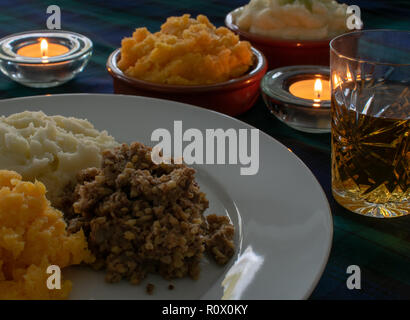 Burns Supper, haggis with neeps and tatties and a wee dram of Scotch Whisky Stock Photo