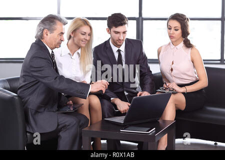 project Manager and the business team are discussing the new project Stock Photo