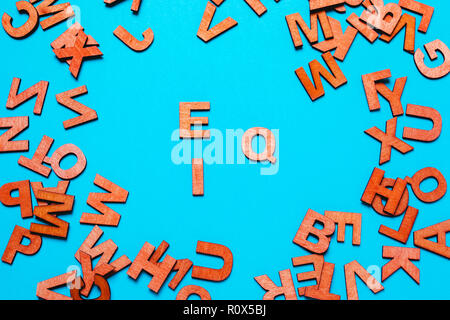 Word EQ,IQ of wooden letters  on a blue background Stock Photo