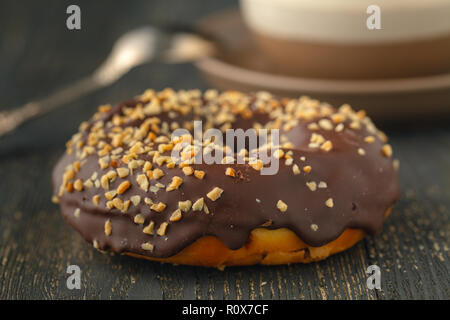 Choco donuts on wooden background. Stock Photo