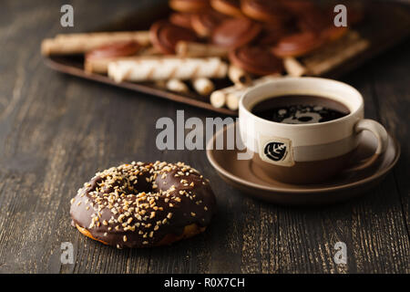 Choco donuts on wooden background. Stock Photo