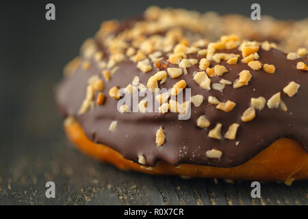 Choco donuts on wooden background. Stock Photo
