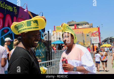 two men in foam nathans famous hotdog hats coney island brooklyn new york USA Stock Photo Alamy