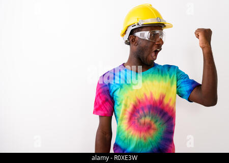 Studio shot of young black African man construction worker weari Stock Photo