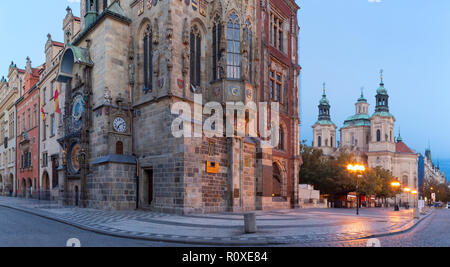 Prague - The Old Town hall, Orloj, Staromestske square and St. Nicholas church at dusk.