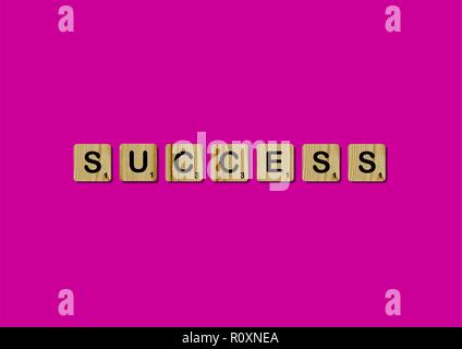 Scrabble tiles spells out   Motivational quote Scrabble Blocks Letters Pink Red Background Life quote Induce Alphabet Stock Photo