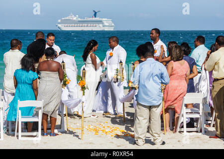 Wedding Bride On The Beach With Cruise Ship View Stock Photo