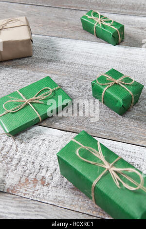 Presents in gift boxes on wooden frame background Stock Photo