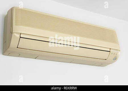 Split conditioner air mounted on a white wall. Home equipment Stock Photo