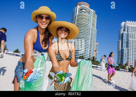 Miami Beach Florida,Atlantic Ocean,water,public beach,shoreline,ECOMB Big Sweep,volunteer volunteers volunteering work worker workers,teamwork working Stock Photo
