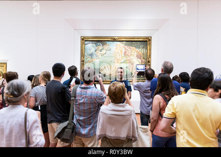 Florence, Italy - August 30, 2018: Famous Birth of Venus painting by Sandro Botticelli in Firenze Uffizi Gallery with many people, visitors taking pho Stock Photo