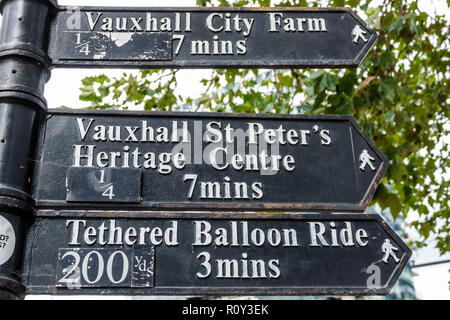 London England,UK,Lambeth Vauxhall,directional post sign,location,arrow,walking distance,Vauxhall City Farm,St. Peter's Heritage Centre,Tethered Ballo Stock Photo