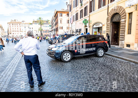 Rome, Italy - September 4, 2018: Piazza Di Spagna square in Roma, street, road with many carabinieri armed military police forces, men, policemen, car