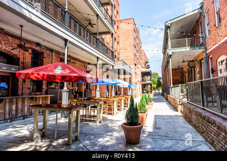 Montgomery, USA - April 21, 2018: Brick buildings restaurant on Alley street during day in capital Alabama city in downtown old town Stock Photo