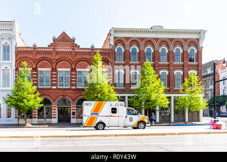 Montgomery, USA - April 21, 2018: Riverfront park buildings on road street during day in capital Alabama city in downtown old town, ambulance Stock Photo