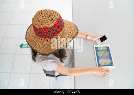 student working with tablet in library Stock Photo