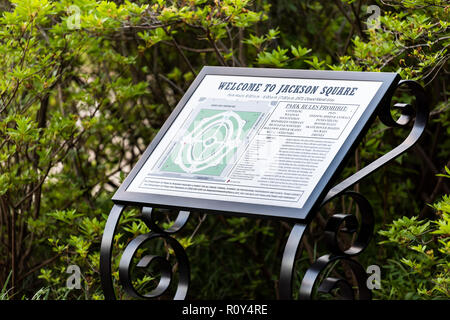 New Orleans, USA - April 22, 2018: Downtown old town Louisiana town city with famous Jackson Square park, green spring plants, sign map Stock Photo