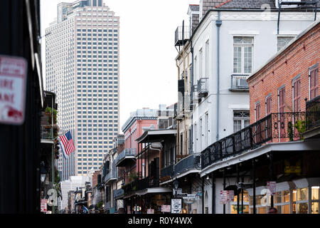 New Orleans, USA - April 22, 2018: Downtown old town dark night Royal street in Louisiana famous town, city with skyscraper Stock Photo