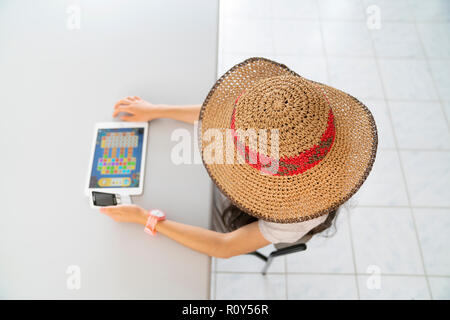 student working with tablet in library Stock Photo