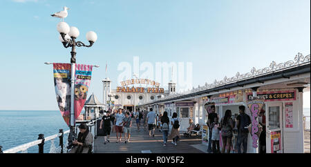 BRIGHTON, ENGLAND - JULY 9, 2018: Tourists in Brighton Palace Pier on Brighton beach, Brighton, UK. Stock Photo