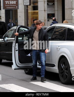Milan, Riccardo Montolivo goes to Damiani to buy a present to his wife Riccardo Montolivo, AC Milan captain, after the birth of MARIAM two years ago, he became the father of a handsome boy named MATHIAS. To celebrate the happy event, he decided to go to 'DAMIANI', the prestigious jeweler's in Via Montenapoleone, to give a present to his wife CRISTINA DE PIN. Note the cover of his cell phone, with his wife and little Mariam. Stock Photo