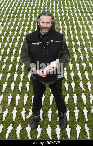 London, Britain. 7th Nov, 2018. Artist Rob Heard poses for photos with his installation 'Shrouds of the Somme' at the Queen Elizabeth Olympic Park in London, Britain, on Nov. 7, 2018. 'Shrouds of the Somme' is an art installation representing 72,396 British Commonwealth servicemen killed at the Battle of the Somme who have no known grave to mark 100 years since the end of the First World War. Credit: Ray Tang/Xinhua/Alamy Live News Stock Photo