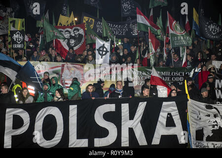 November 11, 2017 - Warsaw, mazowieckie, Poland - Polish and Hungarian nationalists seen with the White Power placard on the Independence Day during the protest.Last year about 60,000 people took part in the nationalist march marking Poland's Independence Day, according to police figures. The march has taken place each year on November 11th for almost a decade, and has grown to draw tens of thousands of participants, including extremists from across the EU.Warsaw's mayor Hanna Gronkiewicz-Waltz has banned the event. Organizers said they would appeal against the decision, insisting they w Stock Photo