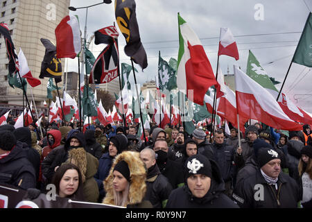 November 11, 2017 - Warsaw, mazowieckie, Poland - Nationalists seen waving flags on the Independence Day during the demonstration.Last year about 60,000 people took part in the nationalist march marking Poland's Independence Day, according to police figures. The march has taken place each year on November 11th for almost a decade, and has grown to draw tens of thousands of participants, including extremists from across the EU.Warsaw's mayor Hanna Gronkiewicz-Waltz has banned the event. Organizers said they would appeal against the decision, insisting they would go ahead with the march an Stock Photo