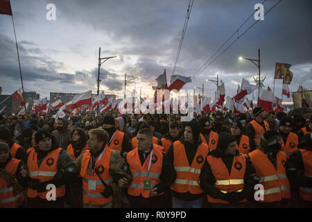 November 11, 2017 - Warsaw, mazowieckie, Poland - Huge crowds seen marching in the streets with reflector jackets during the demonstration.Last year about 60,000 people took part in the nationalist march marking Poland's Independence Day, according to police figures. The march has taken place each year on November 11th for almost a decade, and has grown to draw tens of thousands of participants, including extremists from across the EU.Warsaw's mayor Hanna Gronkiewicz-Waltz has banned the event. Organizers said they would appeal against the decision, insisting they would go ahead with the Stock Photo