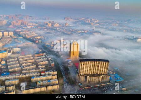 Yuncheng. 8th Nov, 2018. Aerial photo taken on Nov. 8, 2018 shows fog floating above Yuncheng City of north China's Shanxi Province. Credit: Shang Jianzhou/Xinhua/Alamy Live News Stock Photo