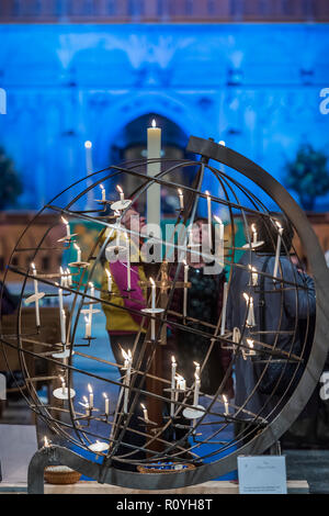 Norwich, UK. 7th November, 2018. After the service people place their candles in the Peace Globe - Evensong attended by the Archbishop of Canterbury and the Bishop of Norwich, on the theme of reconciliation, in Norwich Cathedral. Credit: Guy Bell/Alamy Live News Stock Photo