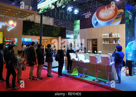 Shanghai, China. 7th Nov, 2018. People taste coffee at the booth of Costa Rica at the first China International Import Expo (CIIE) in Shanghai, east China, Nov. 7, 2018. A total of 82 countries and three international organizations showcased their achievements in economic and trade development as well as competitive products at 71 booths in the Country Pavilion for Trade and Investment at the CIIE. Credit: Wang Tiancong/Xinhua/Alamy Live News Stock Photo