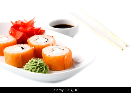 Original Japanese dish rolls with seafood, ginger and wasabi isolated on black background Stock Photo