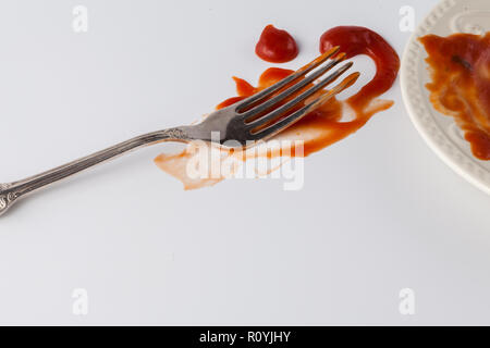 tomato sauce splashes on white backgrounds with fork Stock Photo