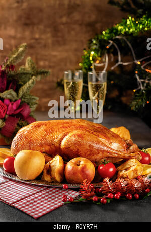 Thanksgiving roasted whole goose on rustic table Stock Photo