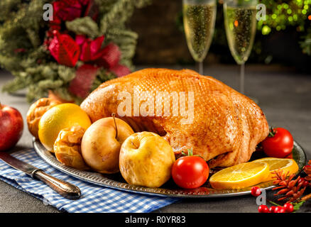 Thanksgiving roasted whole goose on rustic table Stock Photo