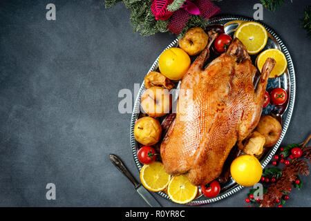 Christmas roasted whole goose on rustic table Stock Photo